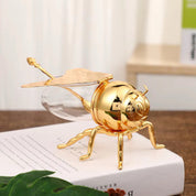 Recipiente abeja dorado con cuchara